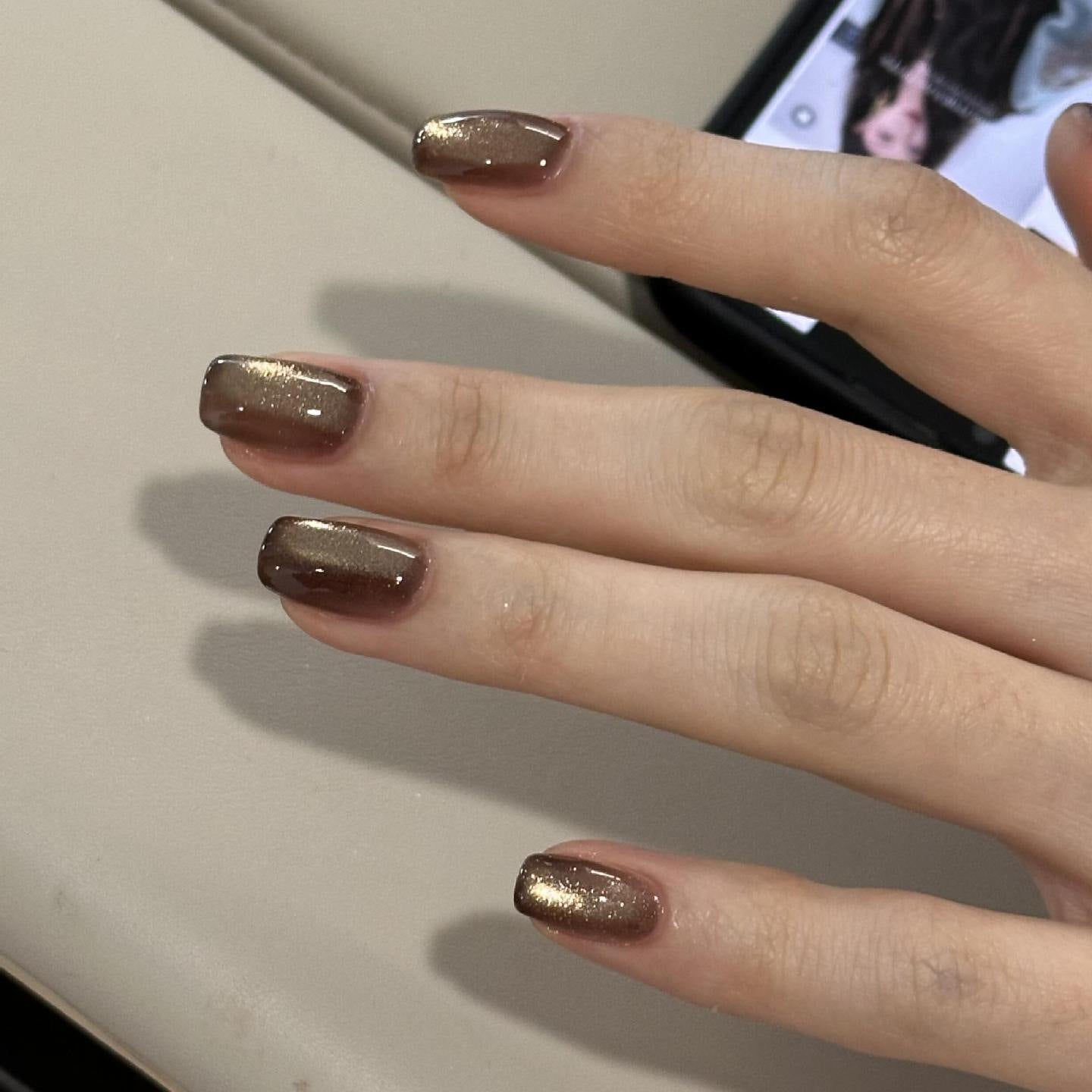 Gold cat-eye short-square press-on nails with chocolate-brown edges