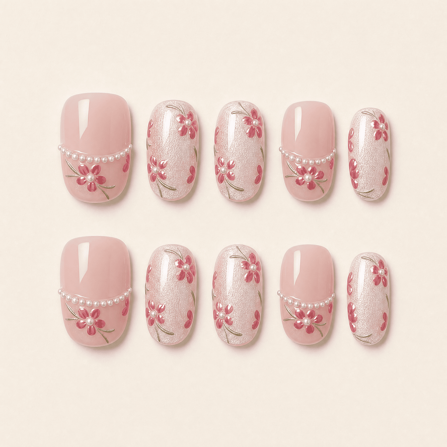 Pink floral cat-eye press-on nails with pearl and translucent details