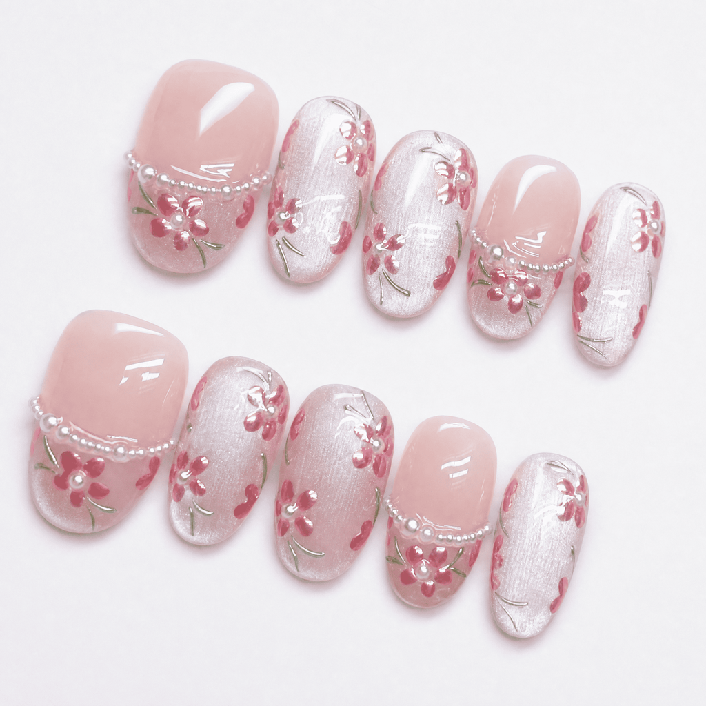 Pink floral cat-eye press-on nails with pearl and translucent details
