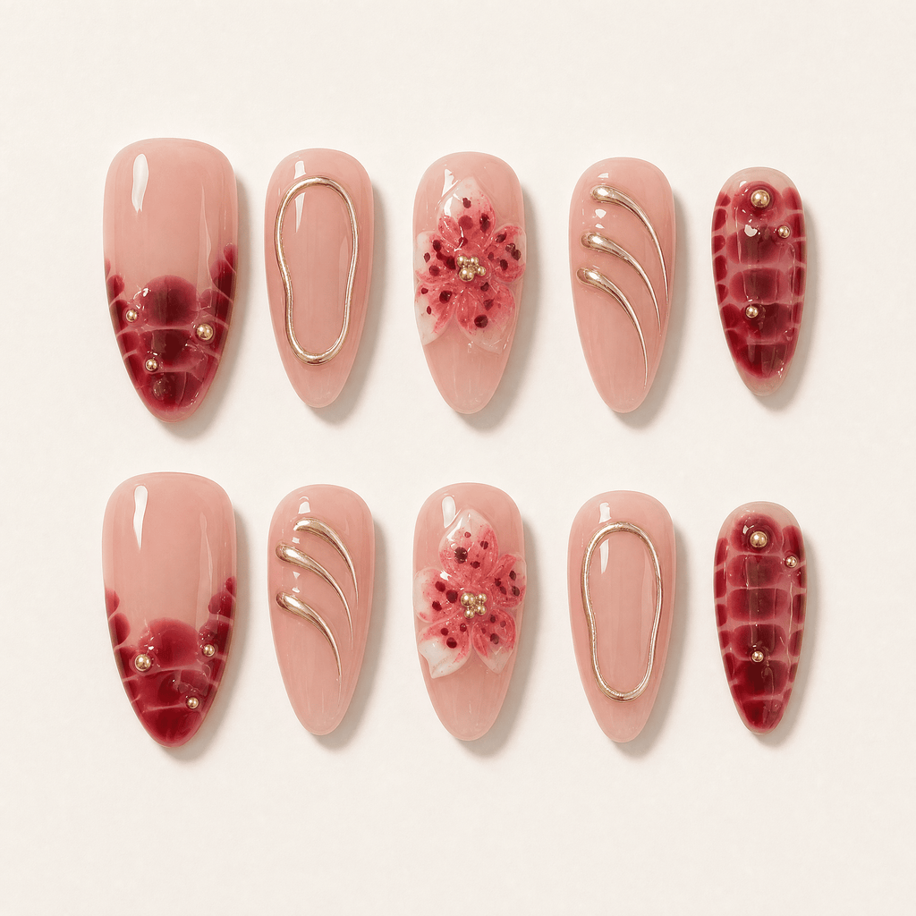 Burgundy floral almond press-on nails worn on one hand