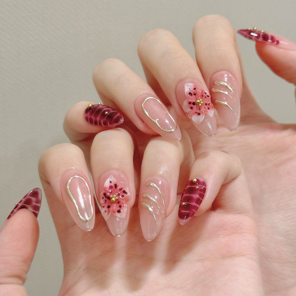Burgundy floral almond press-on nails worn on one handburgundy-bloom-almond-press-on-nails-0
