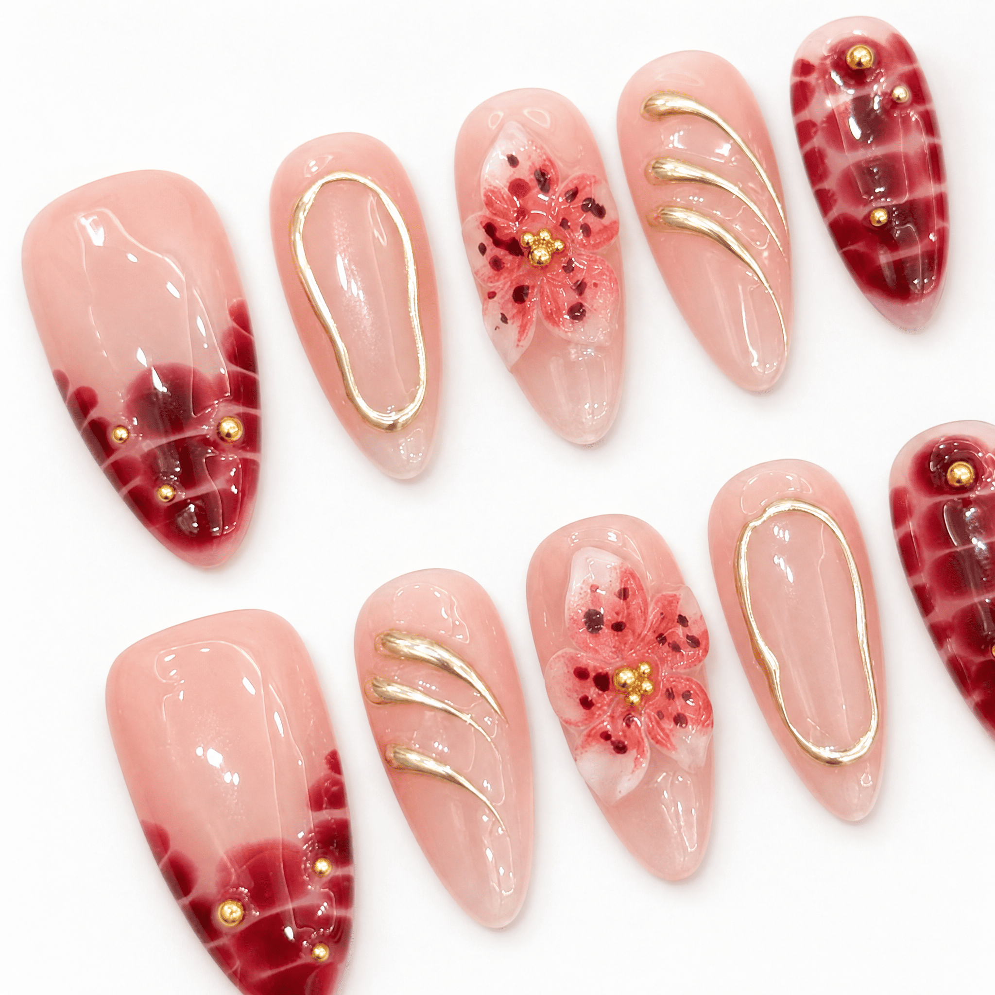 Burgundy floral almond press-on nails worn on one handburgundy-bloom-almond-press-on-nails-0