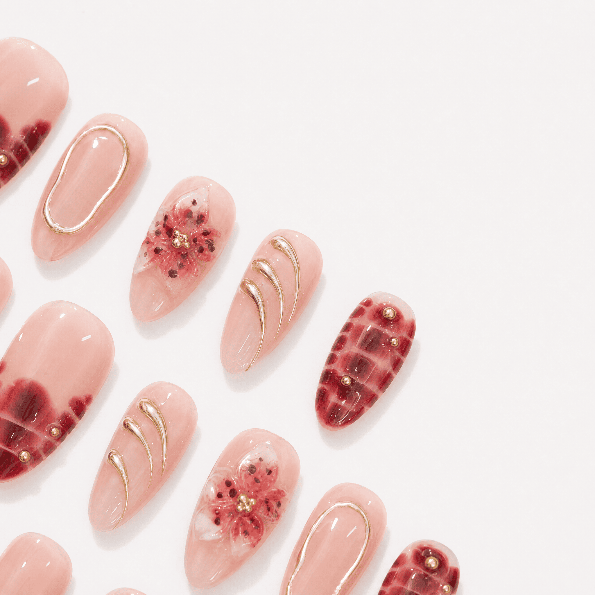 Burgundy floral almond press-on nails worn on one handburgundy-bloom-almond-press-on-nails-0