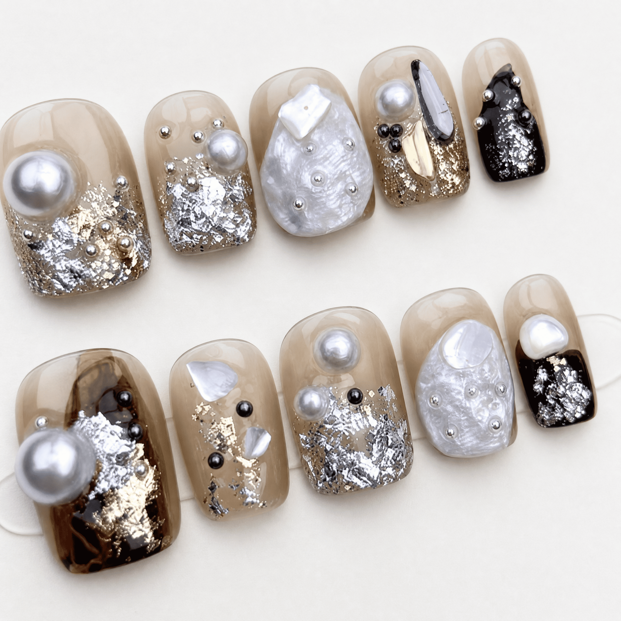 Caramel short-square press-on nails with pearl shell and metallic accents