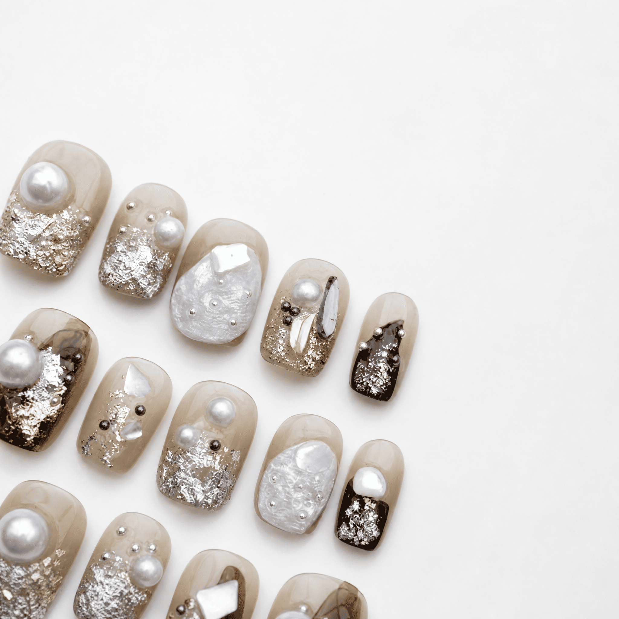 Caramel short-square press-on nails with pearl shell and metallic accents