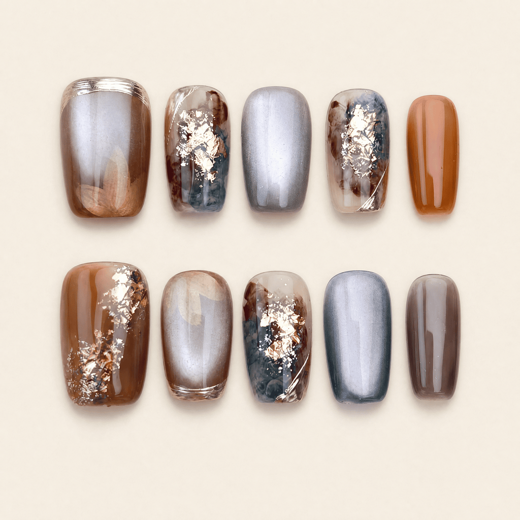 Caramel and smoky-grey cat-eye marble press-on nails with gold foil