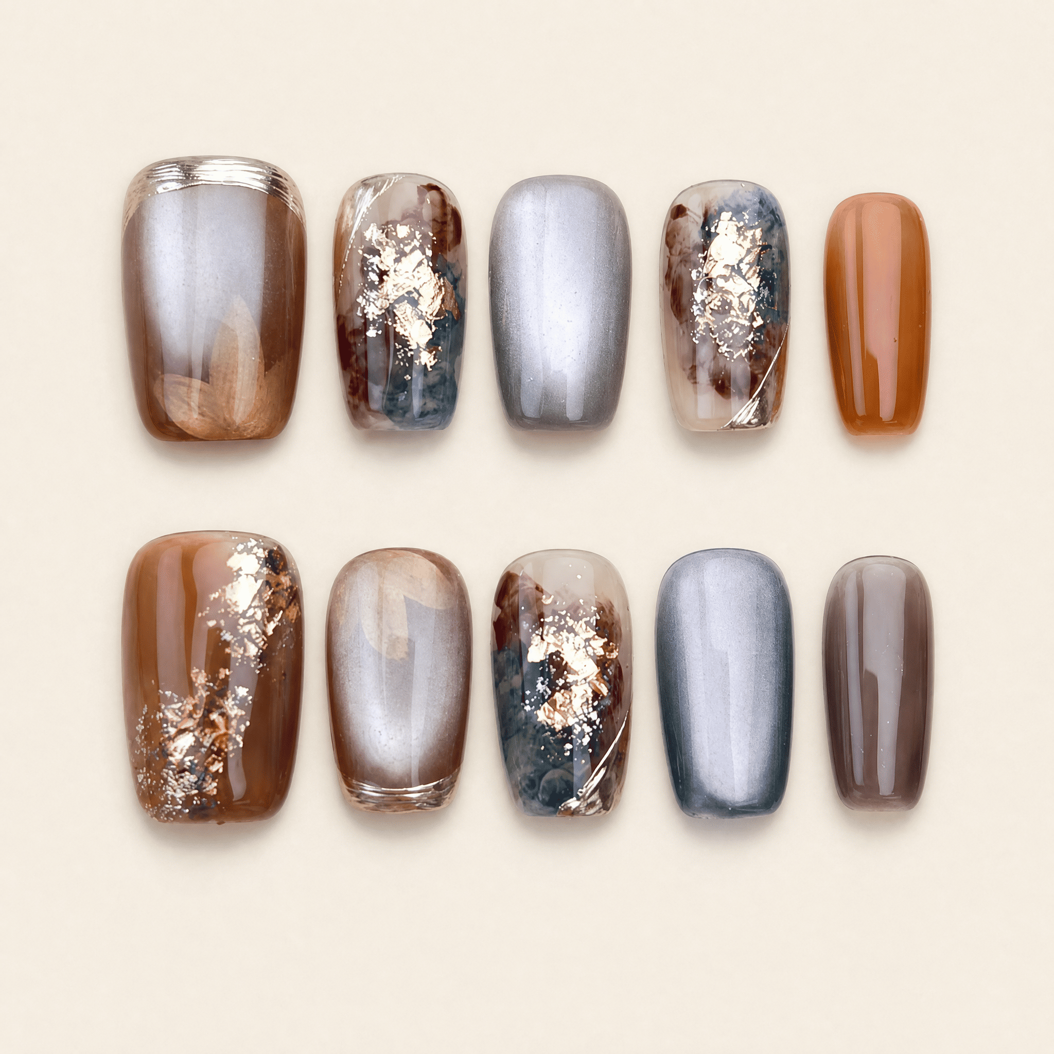 Caramel and smoky-grey cat-eye marble press-on nails with gold foil