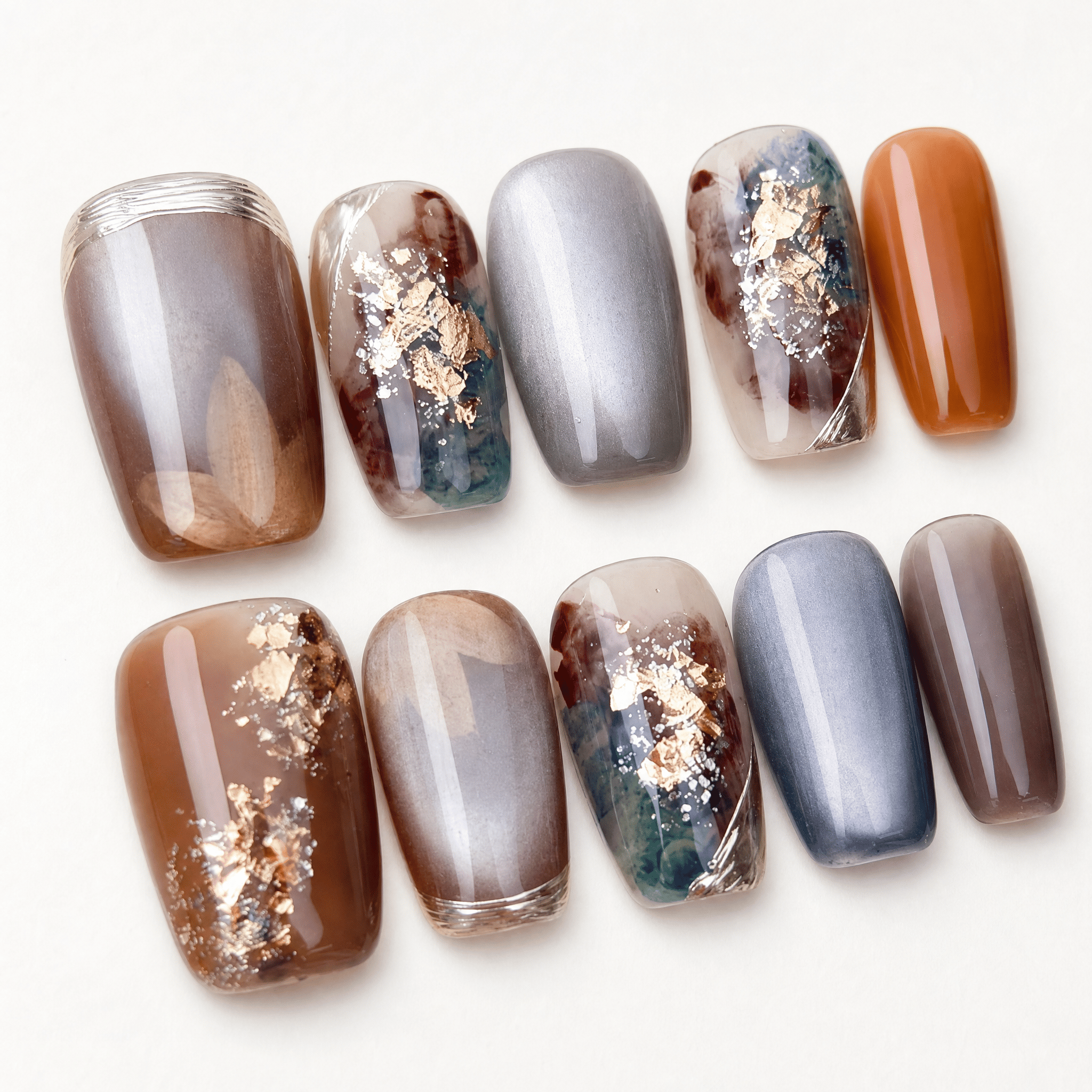 Caramel and smoky-grey cat-eye marble press-on nails with gold foil