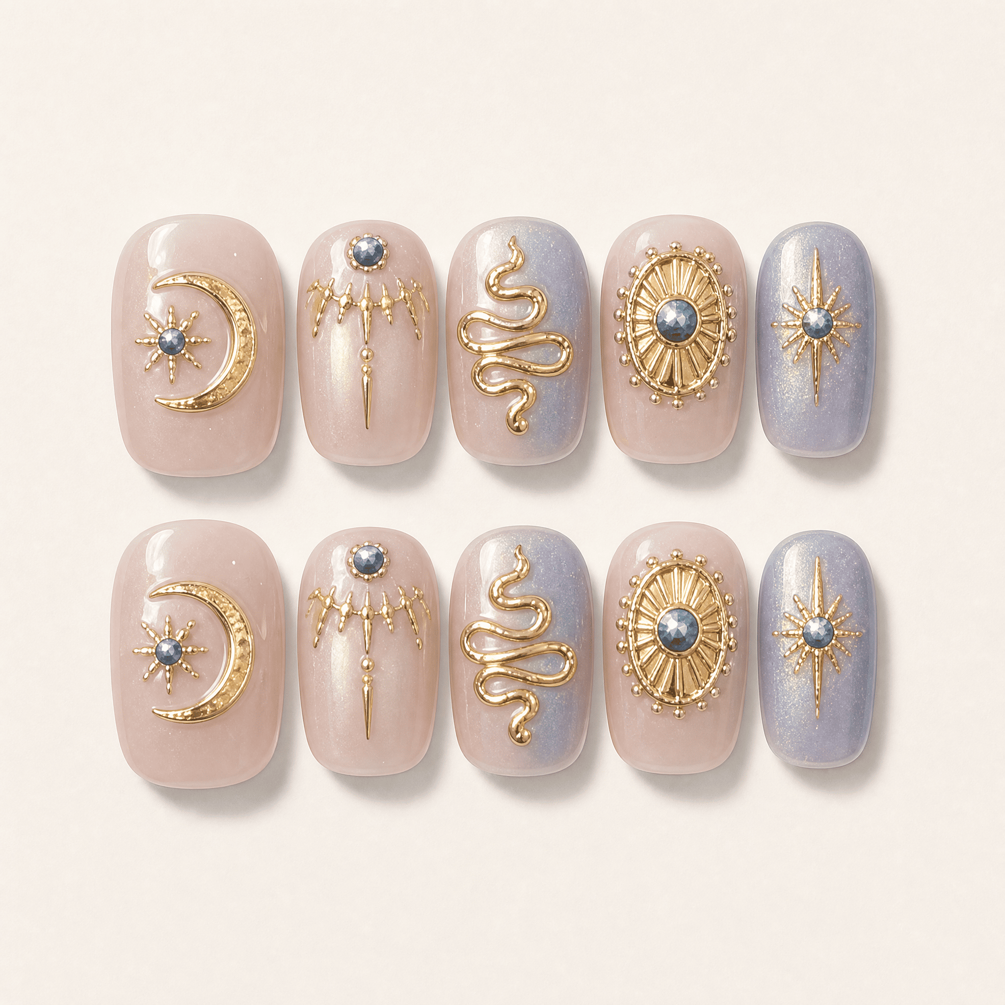Celestial Baroque press-on nails with gold moon and serpent details