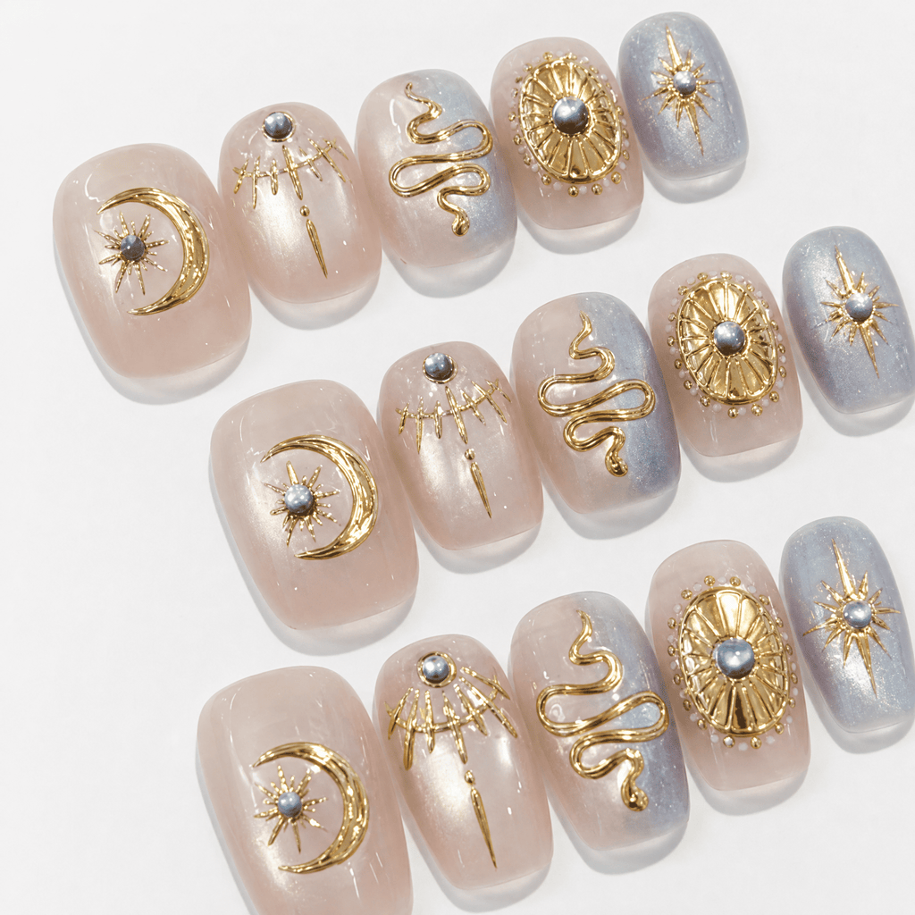 Celestial Baroque press-on nails with gold moon and serpent details