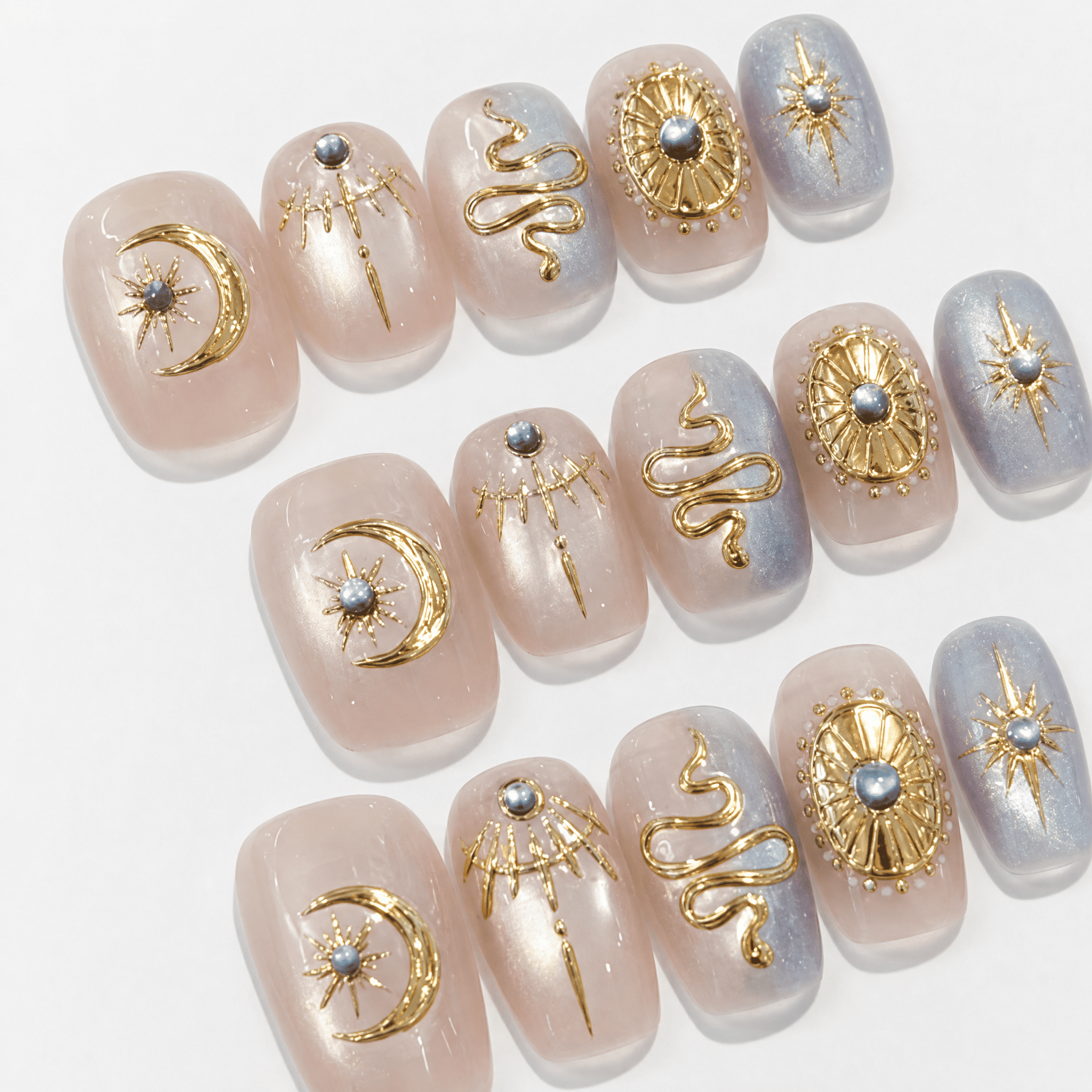 Celestial Baroque press-on nails with gold moon and serpent details