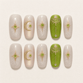 Green and gold short-square press-on nails with celestial designs