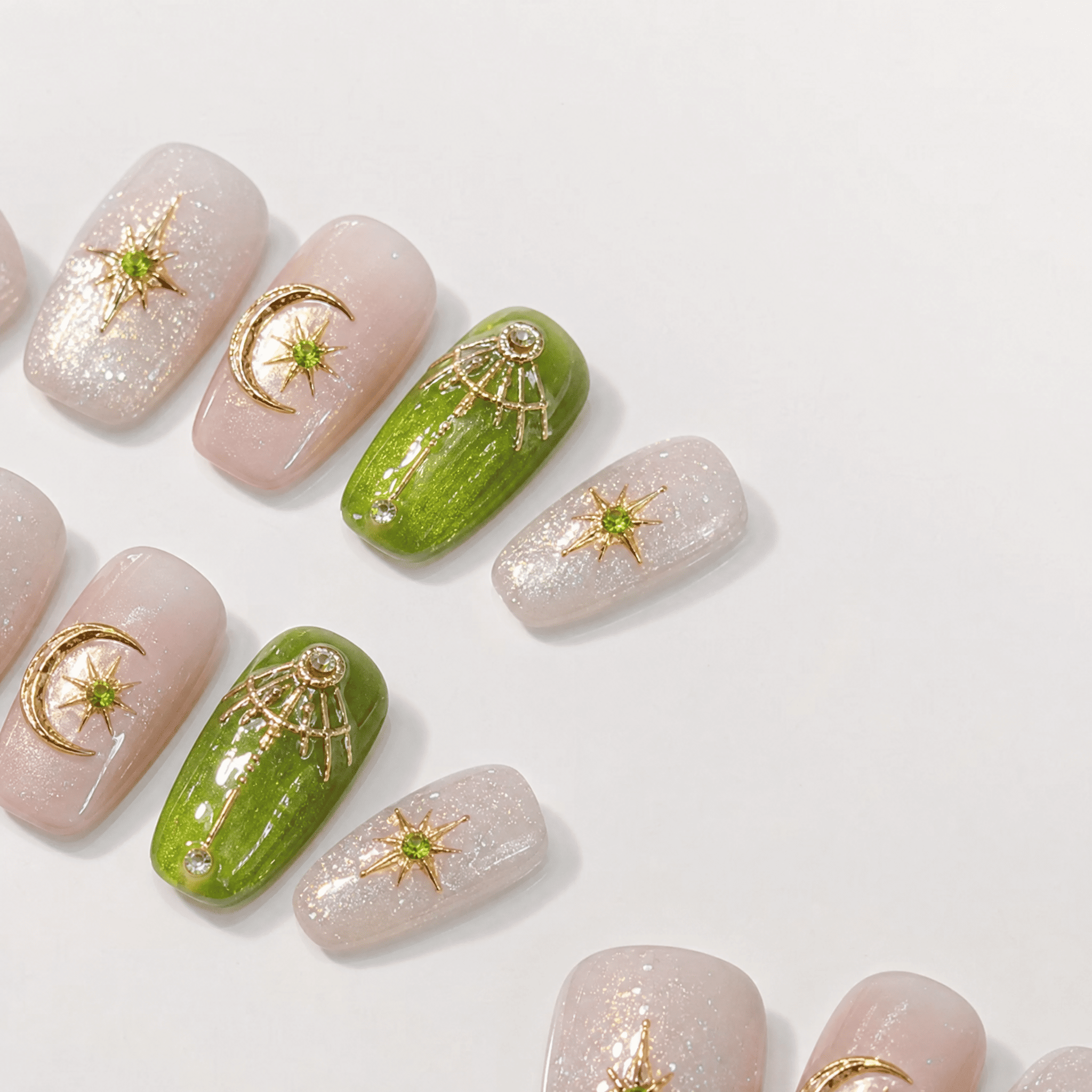 Green and gold short-square press-on nails with celestial designs
