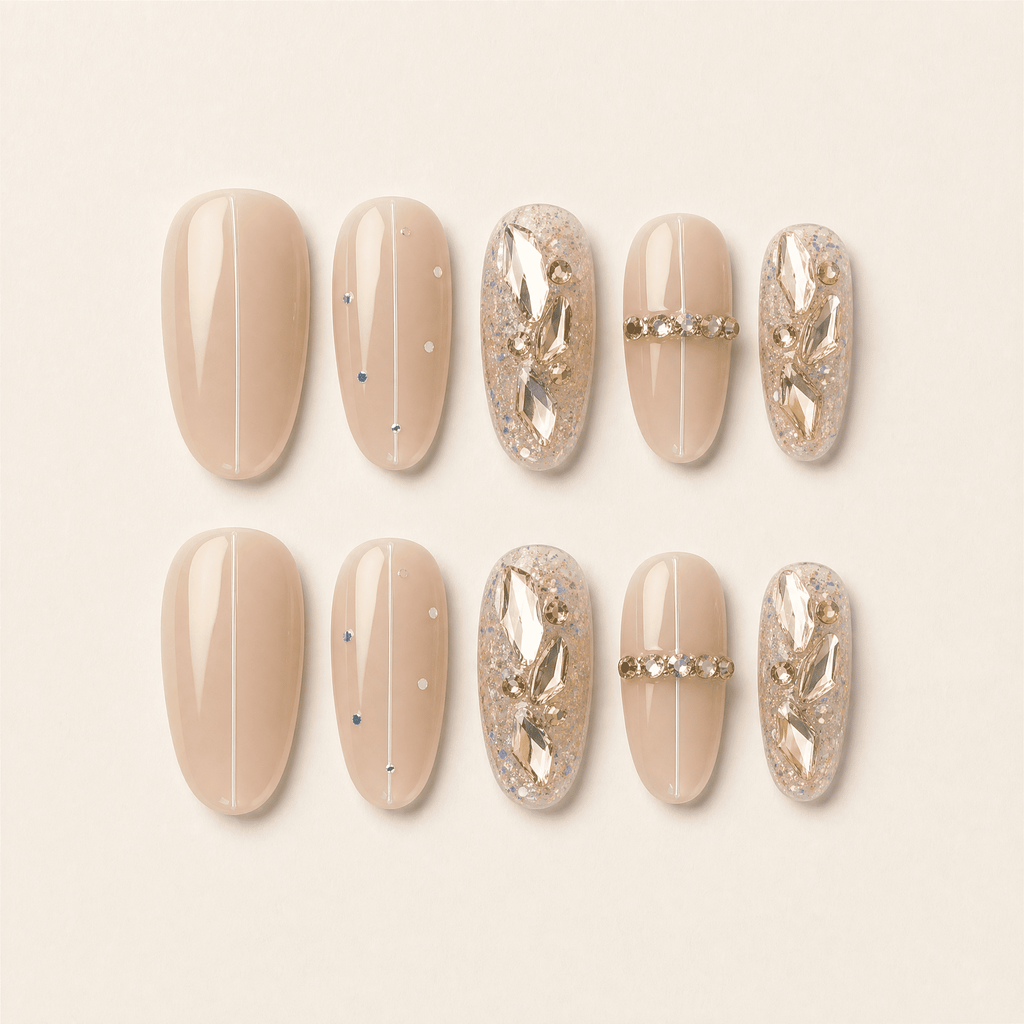 Nude oval cat-eye press-on nails with crystal and gold embellishments