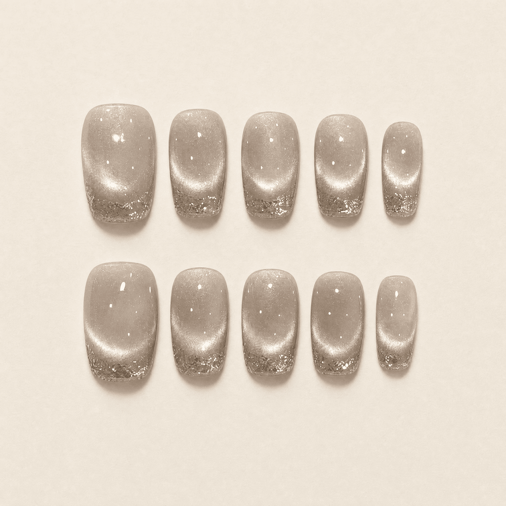 Champagne cat-eye press-on nails with silver glitter French tips