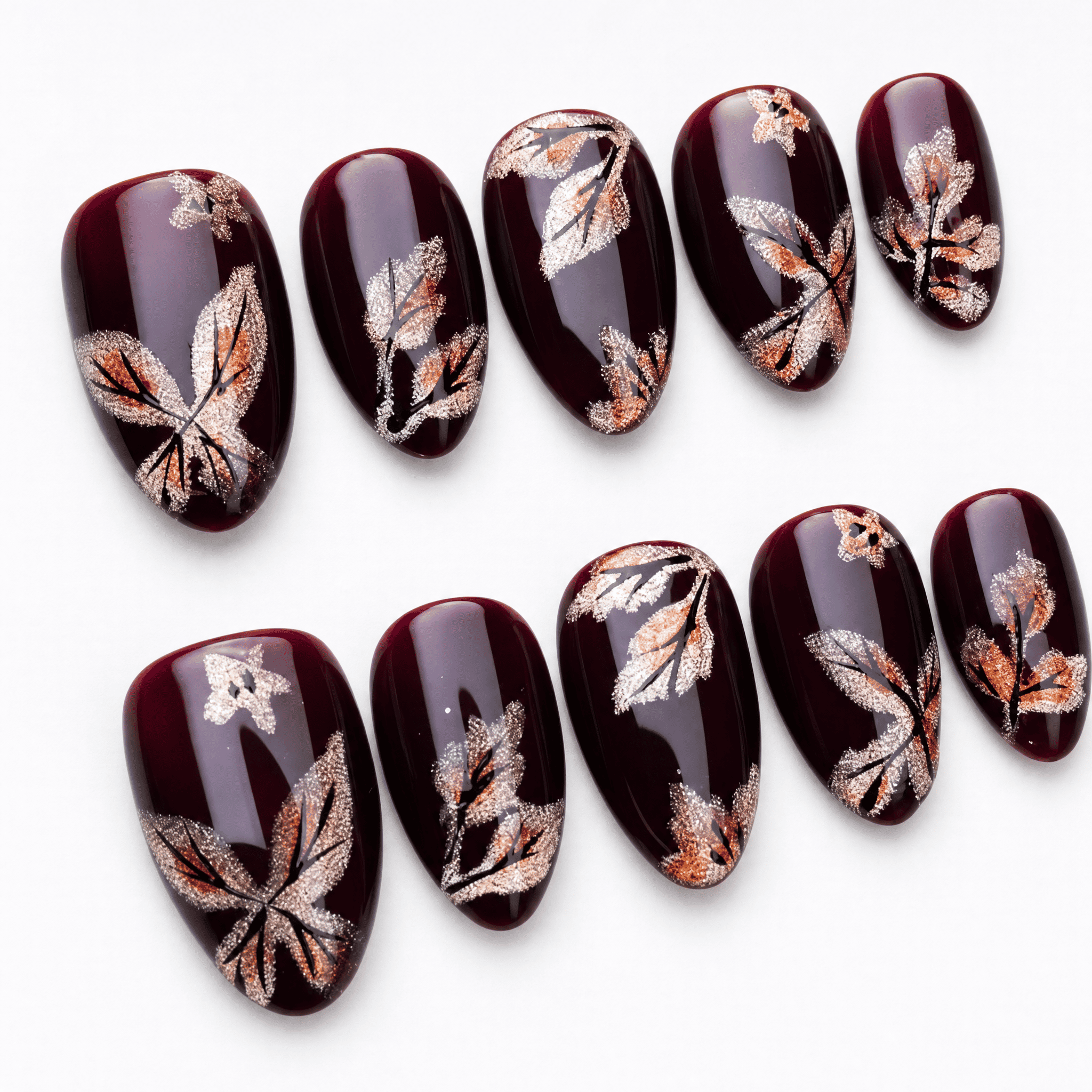 Burgundy short almond press-on nails with shimmering butterfly artwork
