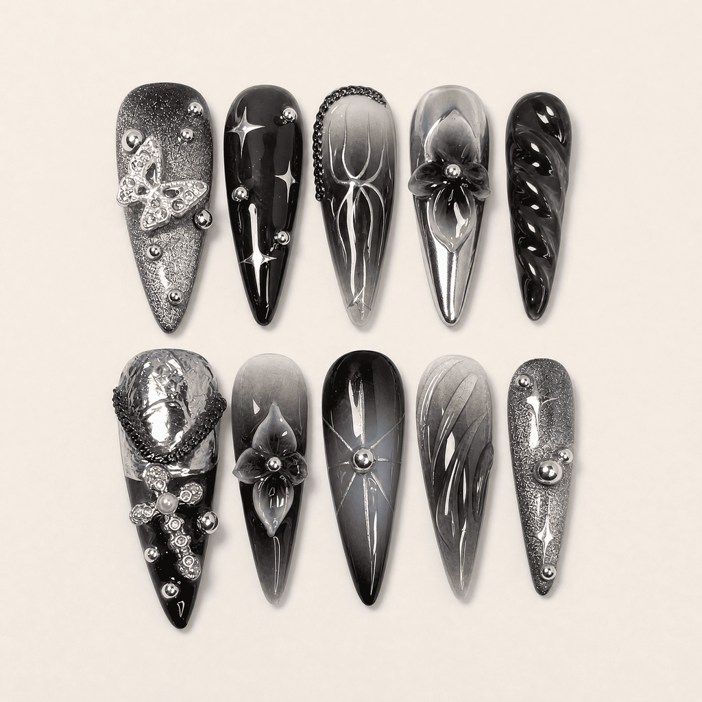Black and silver 3D stiletto press-on nails with butterfly accents