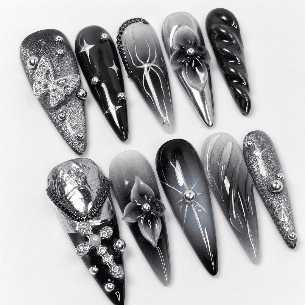 Black and silver 3D stiletto press-on nails with butterfly accents