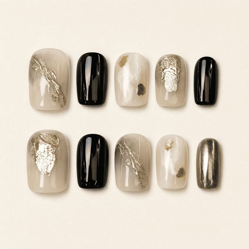 Black and gold short squoval press-on nails with smoky nude accents