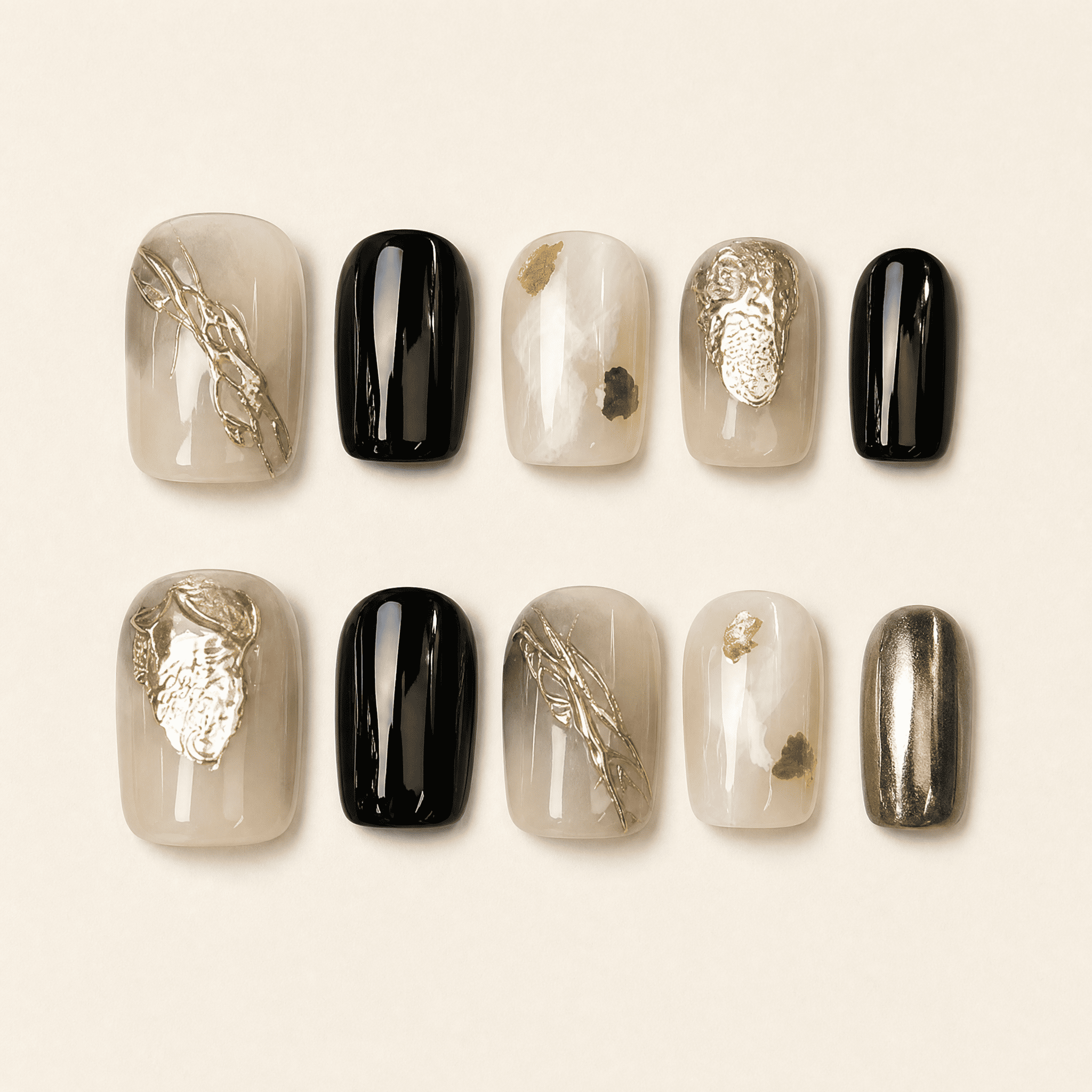 Black and gold short squoval press-on nails with smoky nude accents