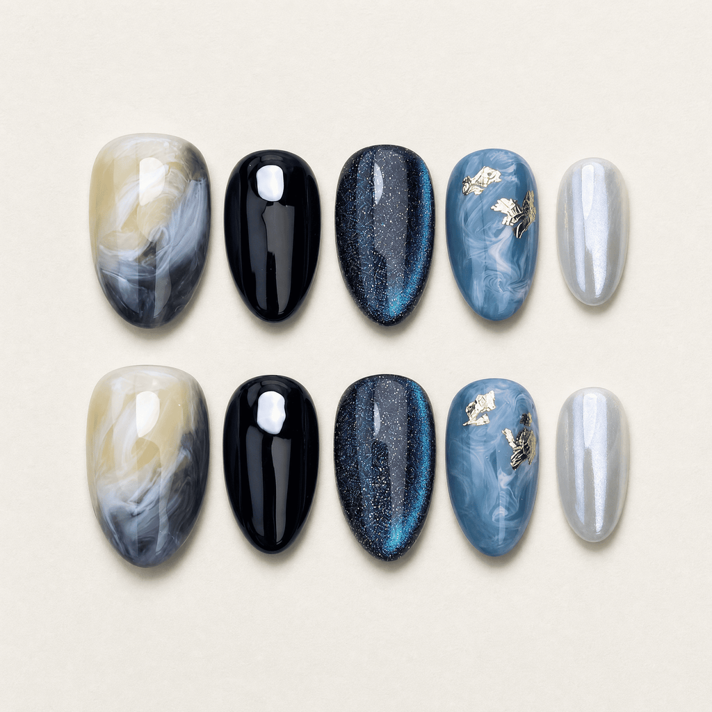 Blue cat-eye short almond press-on nails with black and marble designs