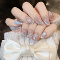 Iridescent blue shell cat-eye press-on nails with pearl accents