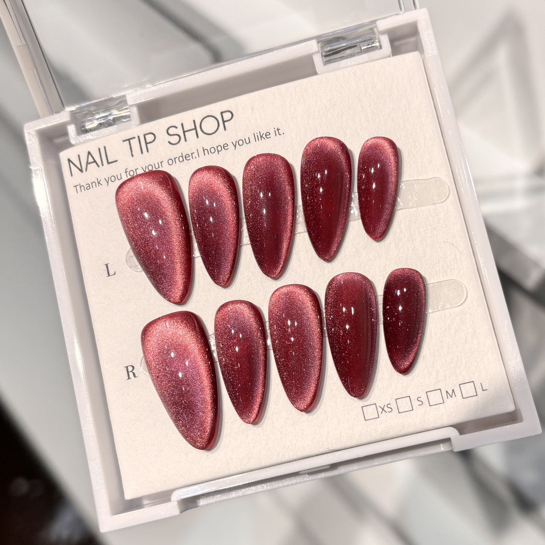 Rose-red cat-eye almond press-on nails with magnetic shimmer
