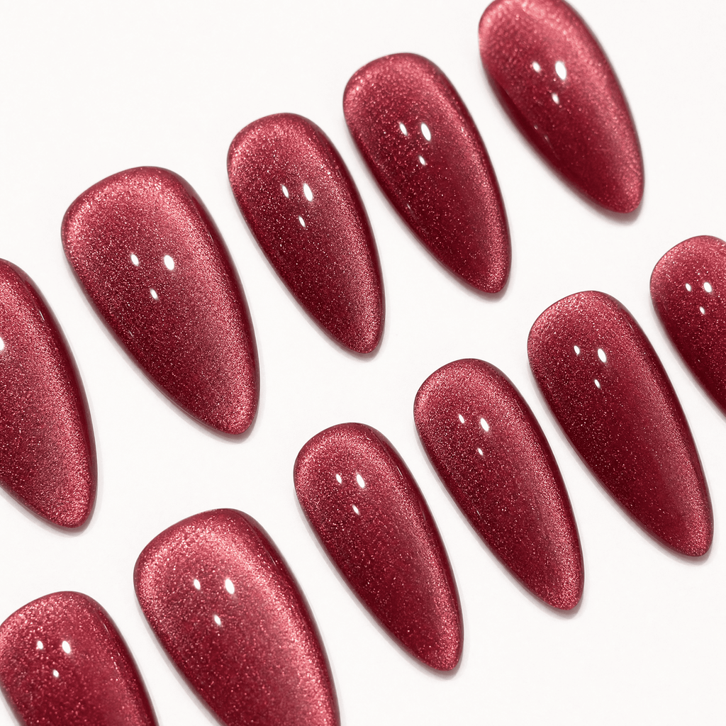 Rose-red cat-eye almond press-on nails with magnetic shimmer