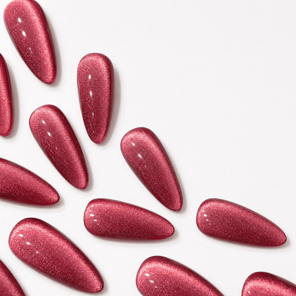 Rose-red cat-eye almond press-on nails with magnetic shimmer