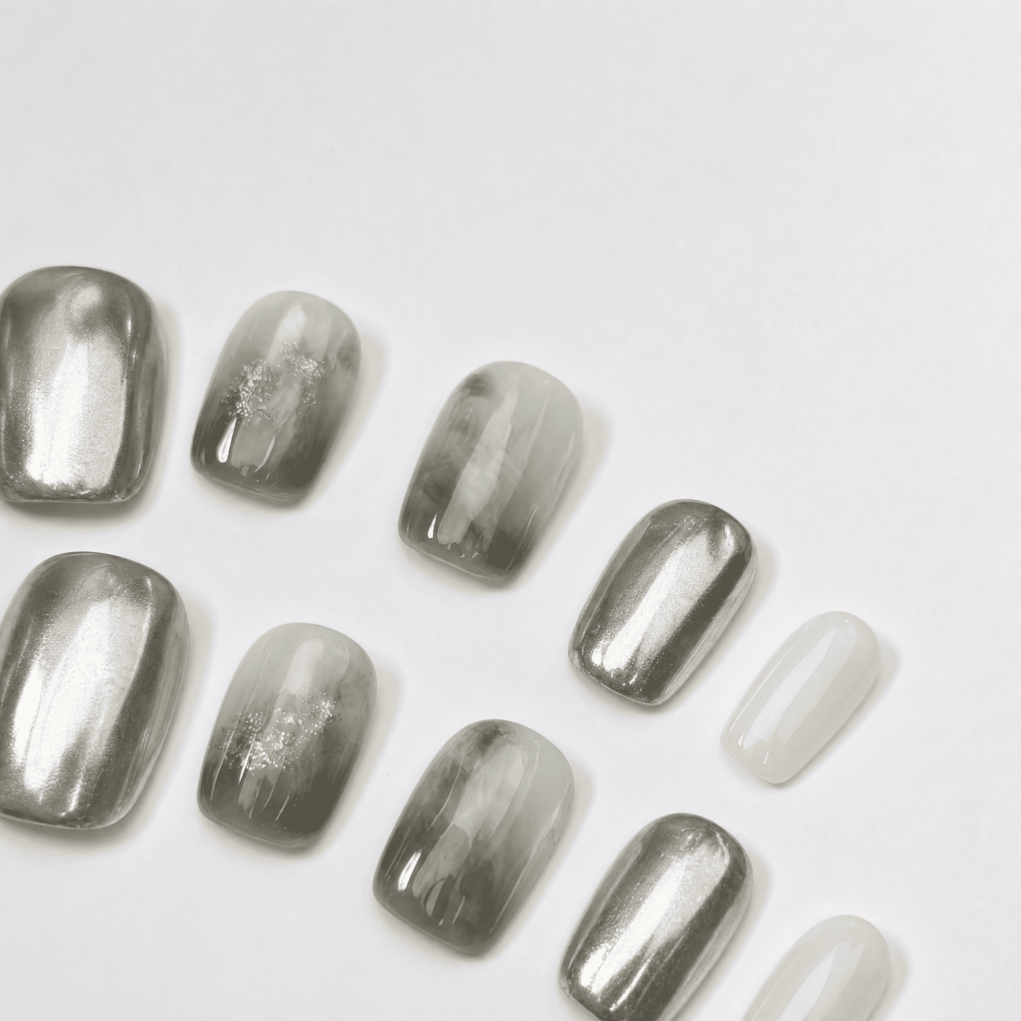 Silver chrome and smoky sage marble short squoval press-on nails